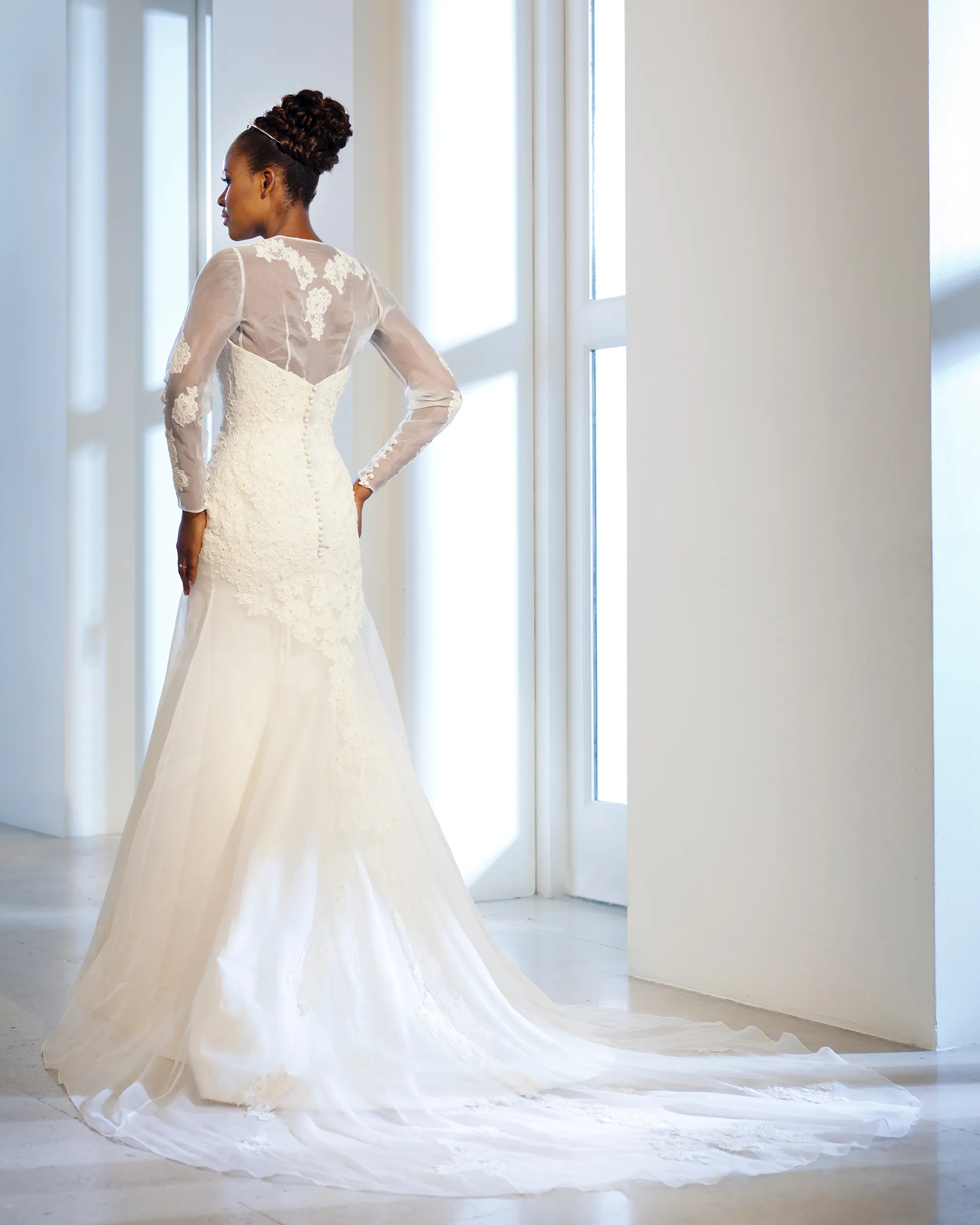 Alexandria, back: lace appliqués on the sheer organza chemise, covered buttons down the lace bodice and the organza train spreading behind.